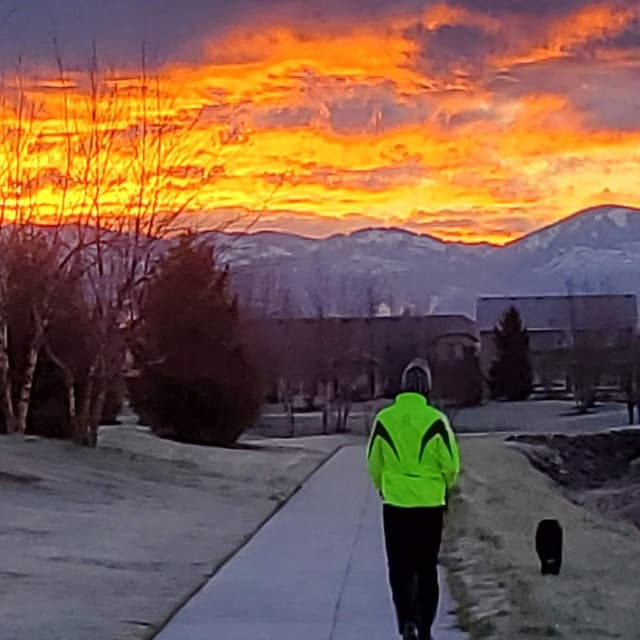 Walking our dog at sunrise